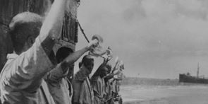 Japanese propaganda photograph from the Pacific War, soldiers holding up pieces of paper.