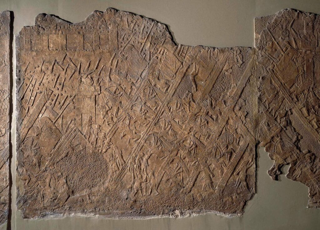 Depiction of Assyrian siege ramps laden with archers and battering rams